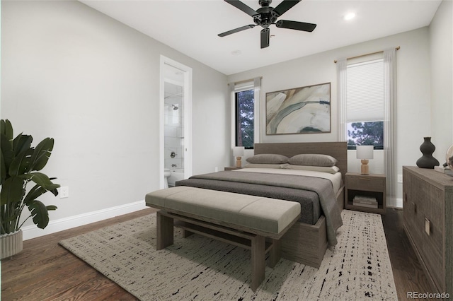 24701 US Highway 40, Golden, CO 80401 - bedroom with wood finished floors, baseboards, connected bathroom, recessed lighting, and multiple windows