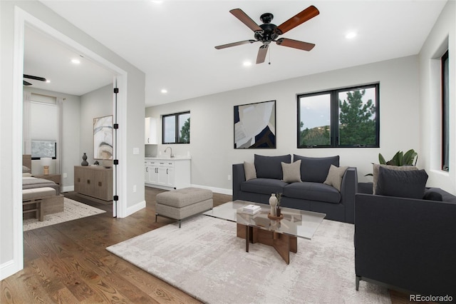 24701 US Highway 40, Golden, CO 80401 - living area with wood finished floors, ceiling fan, recessed lighting, plenty of natural light, and baseboards