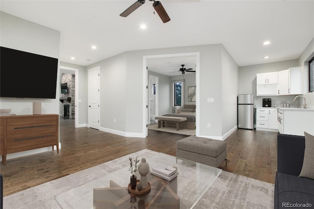 24701 US Highway 40, Golden, CO 80401 - living area featuring a ceiling fan, dark wood-style flooring, baseboards, and recessed lighting