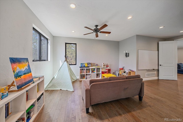 24701 US Highway 40, Golden, CO 80401 - living area featuring a ceiling fan, wood finished floors, recessed lighting, and baseboards