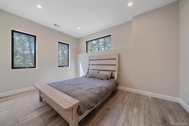 24701 US Highway 40, Golden, CO 80401 - bedroom featuring baseboards, light wood finished floors, and recessed lighting