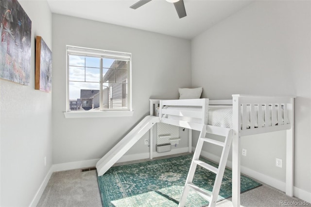 bedroom with carpet floors, ceiling fan, and baseboards