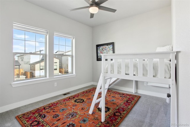 bedroom featuring carpet, visible vents, and baseboards