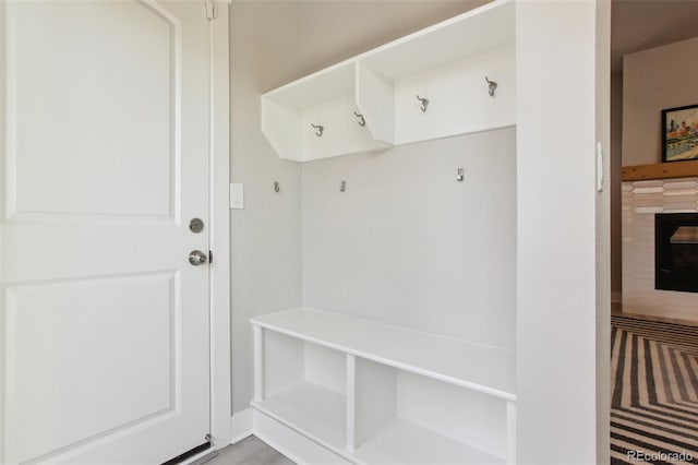 mudroom with a fireplace