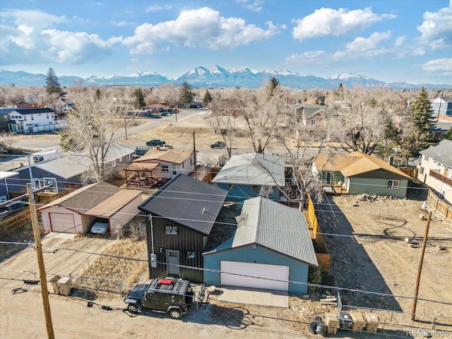 birds eye view of property featuring a mountain view