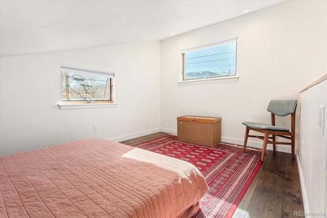 bedroom with lofted ceiling and hardwood / wood-style floors