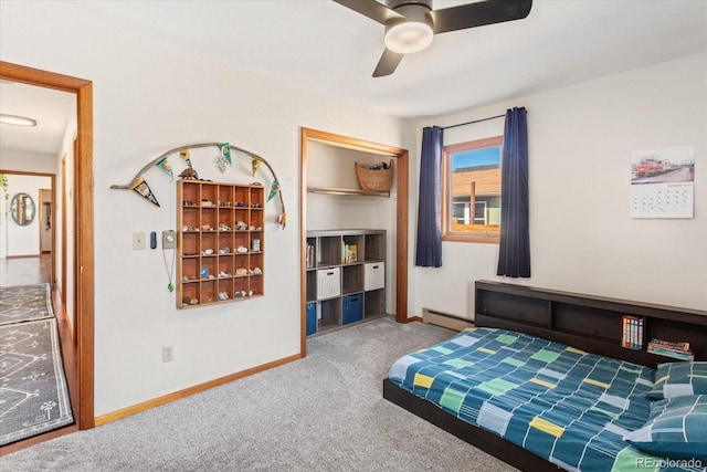 bedroom featuring a baseboard radiator, ceiling fan, and carpet flooring