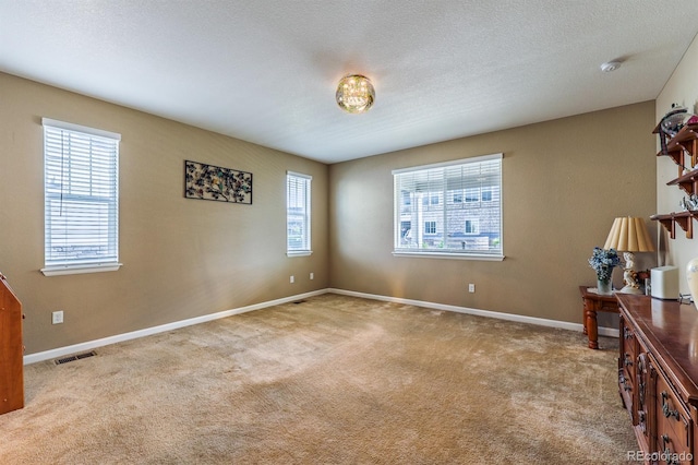 22662 E Narrowleaf Cir, Aurora, CO 80016 - empty room with healthy amount of natural light, carpet floors, and a smoke detector