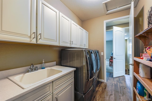 22662 E Narrowleaf Cir, Aurora, CO 80016 - laundry room with dark wood-type flooring, independent washer and dryer, cabinet space, attic access, and baseboards