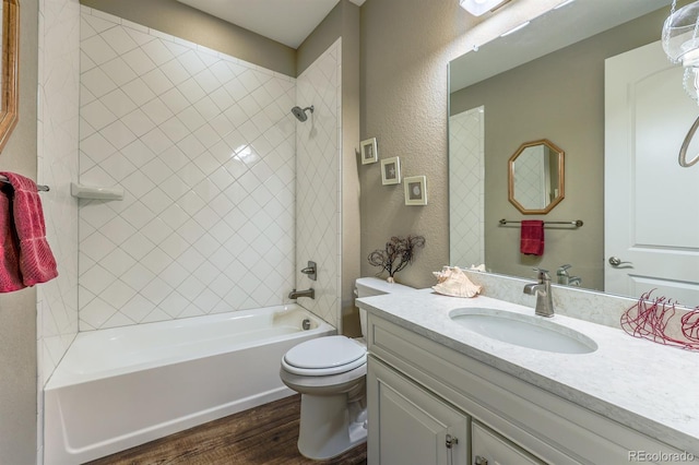 22662 E Narrowleaf Cir, Aurora, CO 80016 - full bath featuring wood finished floors, vanity, toilet,  shower combination, and a textured wall