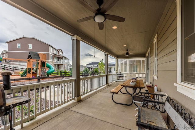 22662 E Narrowleaf Cir, Aurora, CO 80016 - porch featuring ceiling fan, a playground, and a residential view