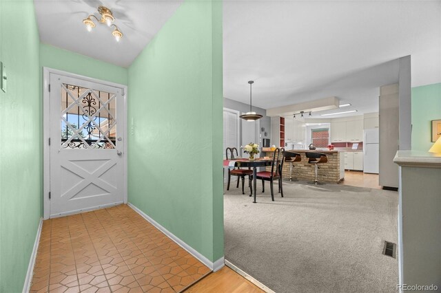8205 Pennsylvania St, Denver, CO 80229 - entryway featuring baseboards