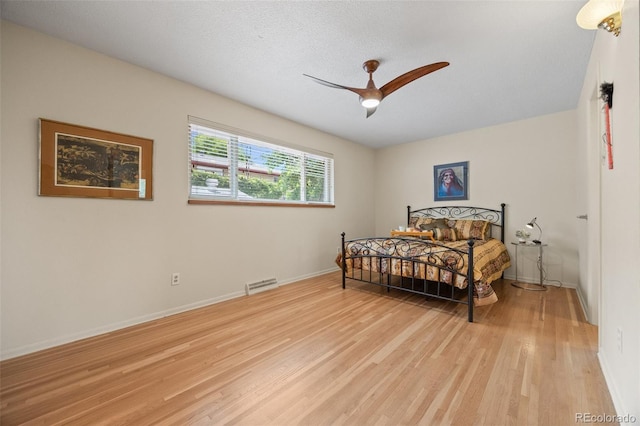8205 Pennsylvania St, Denver, CO 80229 - bedroom with light wood-style floors and ceiling fan