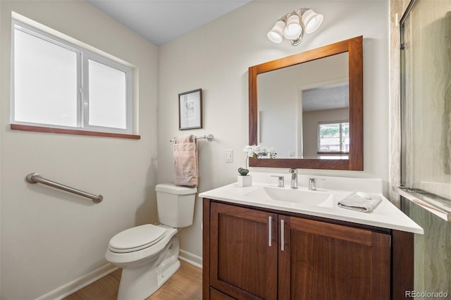 8205 Pennsylvania St, Denver, CO 80229 - bathroom with vanity and wood finished floors