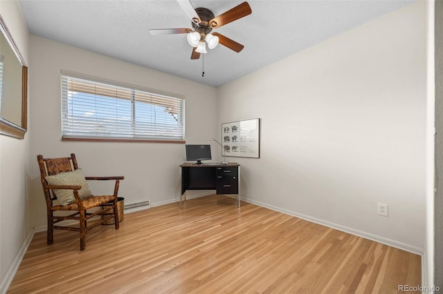 8205 Pennsylvania St, Denver, CO 80229 - living area with light wood finished floors, a ceiling fan, and a textured ceiling