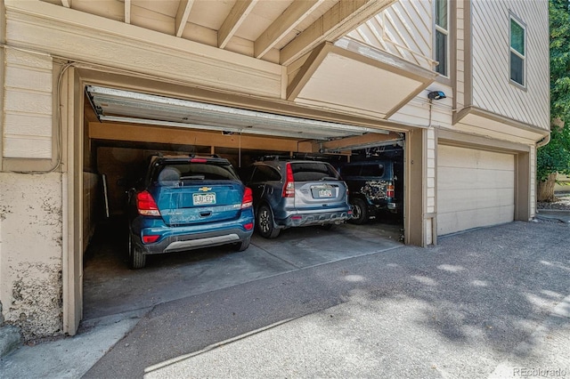 701 Harlan St Unit E29, Lakewood, CO 80214 - garage featuring driveway