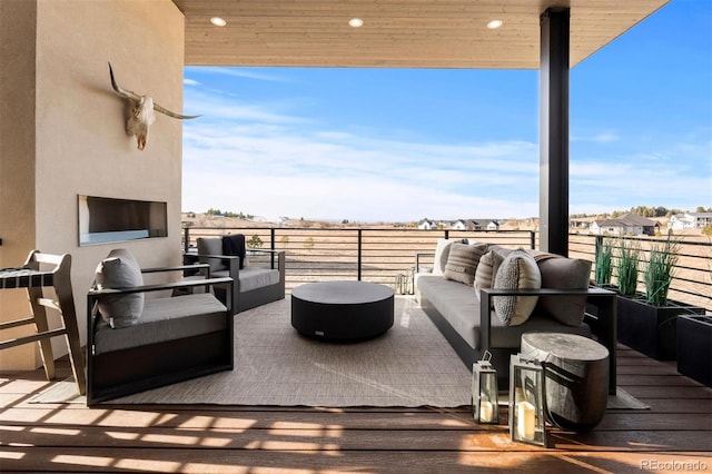 view of patio / terrace with a balcony and an outdoor hangout area