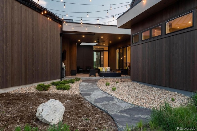 property entrance featuring outdoor lounge area and a patio