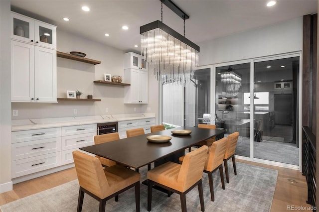 dining area with recessed lighting and light wood-style flooring
