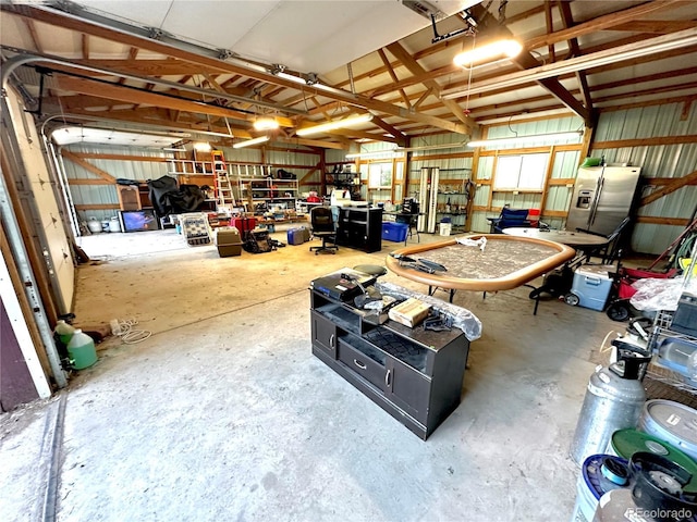 24938 County Road 18, Keenesburg, CO 80643 - garage with stainless steel fridge and a workshop area