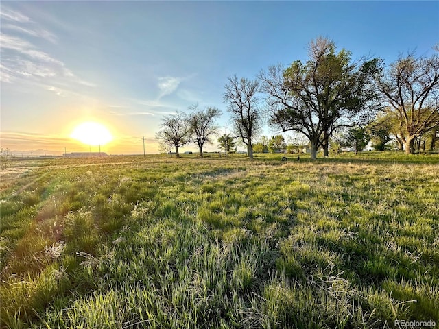 24938 County Road 18, Keenesburg, CO 80643 - yard at dusk with a view of countryside