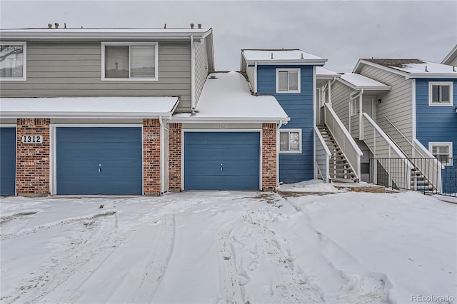 multi unit property featuring a garage