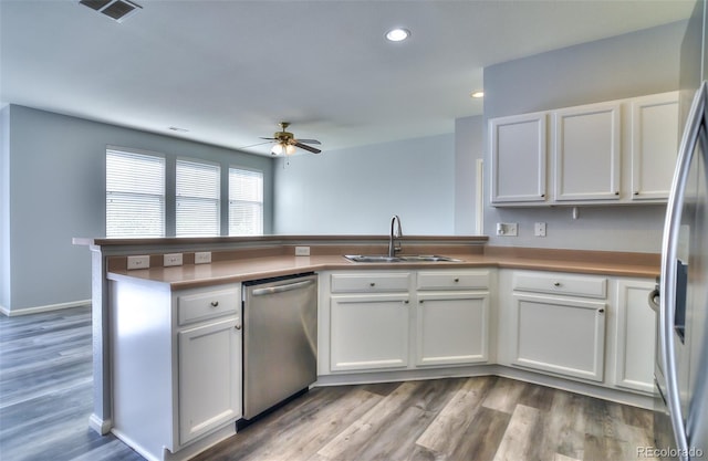 17205 Waterhouse Cir Unit C, Parker, CO 80134 - kitchen with appliances with stainless steel finishes, ceiling fan, a peninsula, white cabinets, and recessed lighting