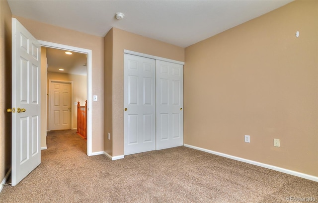 17205 Waterhouse Cir Unit C, Parker, CO 80134 - unfurnished bedroom with light colored carpet, recessed lighting, and a closet