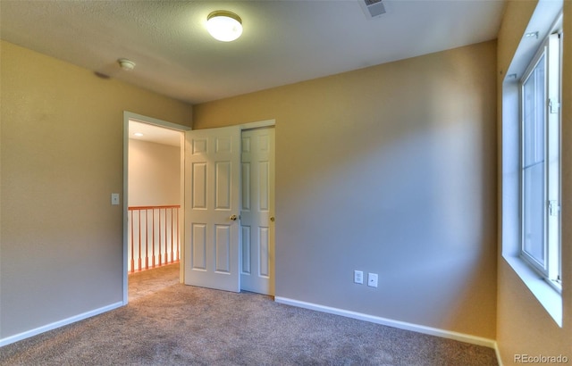 17205 Waterhouse Cir Unit C, Parker, CO 80134 - unfurnished bedroom featuring carpet and baseboards