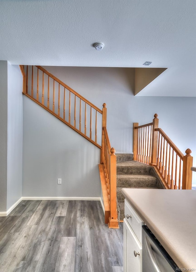 17205 Waterhouse Cir Unit C, Parker, CO 80134 - stairway featuring wood finished floors and a textured ceiling