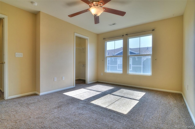 17205 Waterhouse Cir Unit C, Parker, CO 80134 - unfurnished bedroom with carpet floors, a walk in closet, a closet, and a ceiling fan