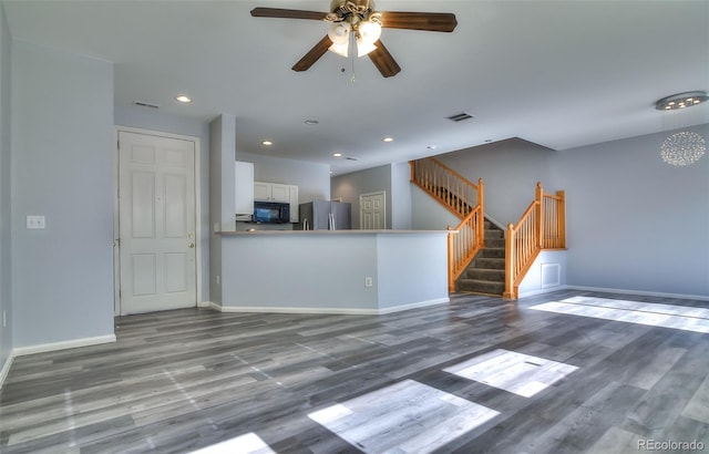 17205 Waterhouse Cir Unit C, Parker, CO 80134 - unfurnished living room featuring recessed lighting, a ceiling fan, wood finished floors, and stairway