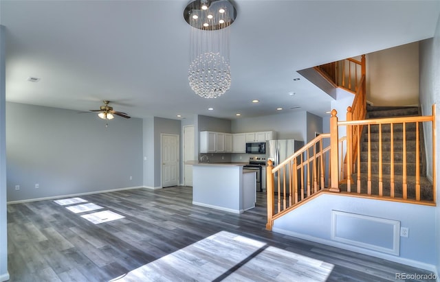 17205 Waterhouse Cir Unit C, Parker, CO 80134 - kitchen featuring appliances with stainless steel finishes, ceiling fan, white cabinetry, wood finished floors, and open floor plan