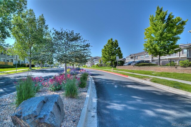 17205 Waterhouse Cir Unit C, Parker, CO 80134 - view of asphalt road featuring a residential view, sidewalks, and curbs