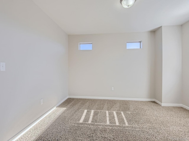 carpeted spare room with plenty of natural light