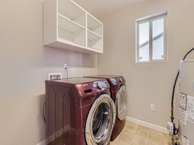 washroom featuring washer and dryer and gas water heater