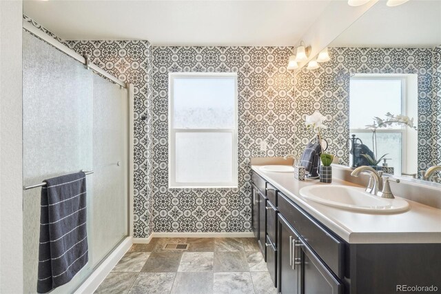 bathroom with vanity and an enclosed shower