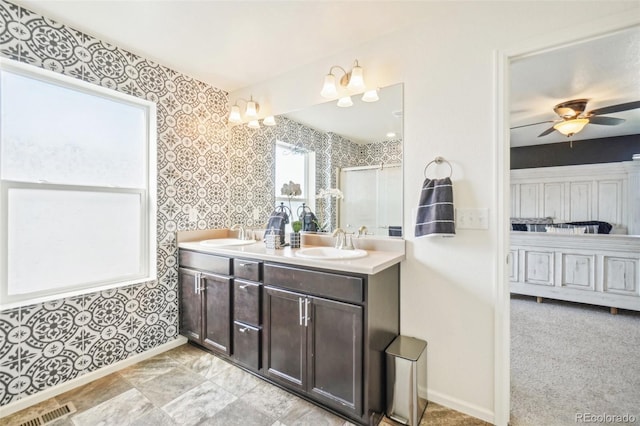 bathroom featuring ceiling fan and vanity