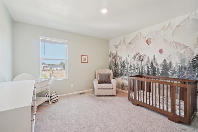 carpeted bedroom with a crib