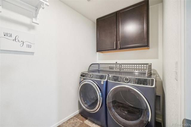 laundry area with cabinets and separate washer and dryer