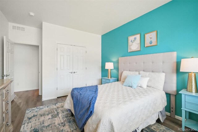 bedroom with hardwood / wood-style flooring and a closet