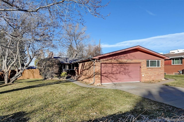 ranch-style home with a front yard and a garage