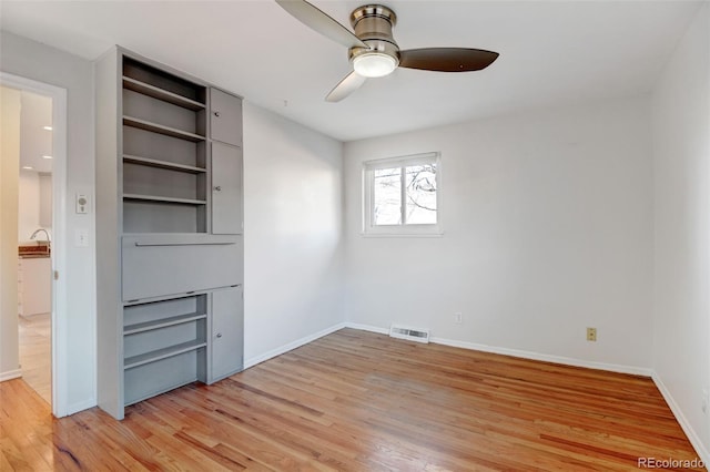 interior space with ceiling fan, a closet, and light hardwood / wood-style flooring