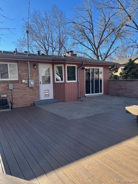 back of house featuring a deck