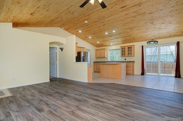 84 Kathy Dr, Buena Vista, CO 81211 - kitchen featuring lofted ceiling, stainless steel fridge, open floor plan, wooden ceiling, and light wood-style floors