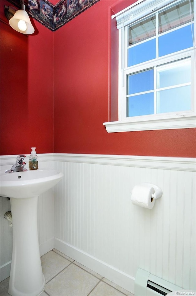 84 Kathy Dr, Buena Vista, CO 81211 - bathroom with wainscoting, tile patterned flooring, and a baseboard radiator