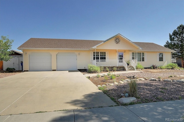 84 Kathy Dr, Buena Vista, CO 81211 - single story home with covered porch, driveway, and a garage