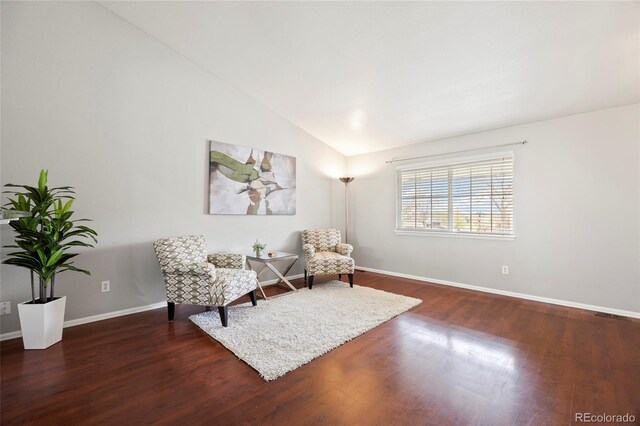 13906 Jackson St, Thornton, CO 80602 - sitting room featuring dark wood-style floors, baseboards, and high vaulted ceiling