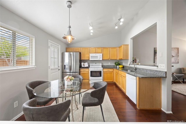13906 Jackson St, Thornton, CO 80602 - kitchen featuring white appliances, a sink, dark wood finished floors, rail lighting, and vaulted ceiling