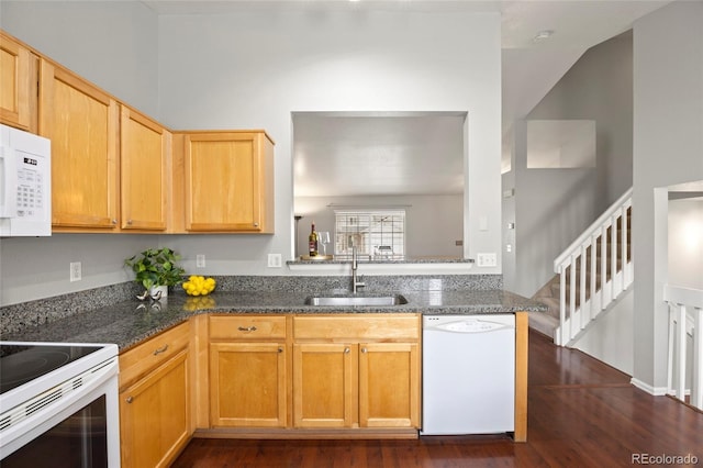 13906 Jackson St, Thornton, CO 80602 - kitchen featuring white appliances, a sink, dark wood-type flooring, and dark stone countertops